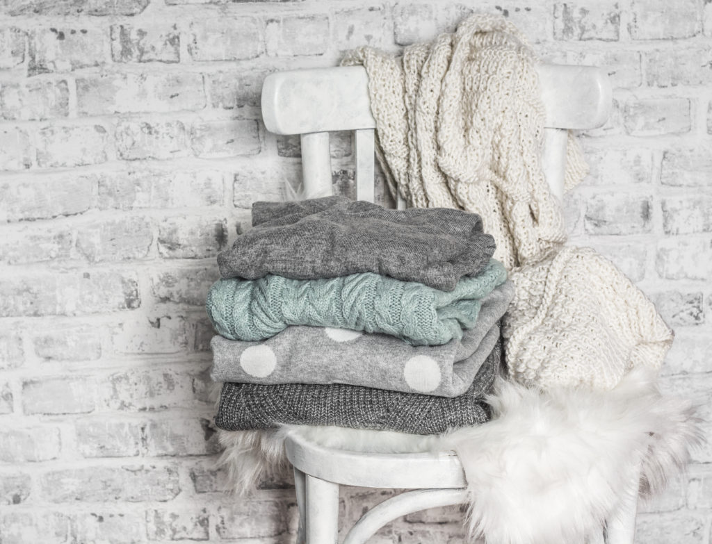 detergent might not be as effective in the winter - pile of sweaters